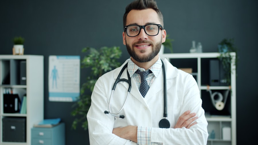 A smiling physician with arms crossed in a modern clinic