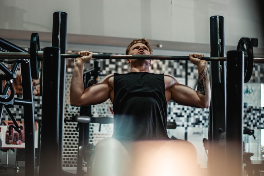 A man strength training with a barbell at the gym